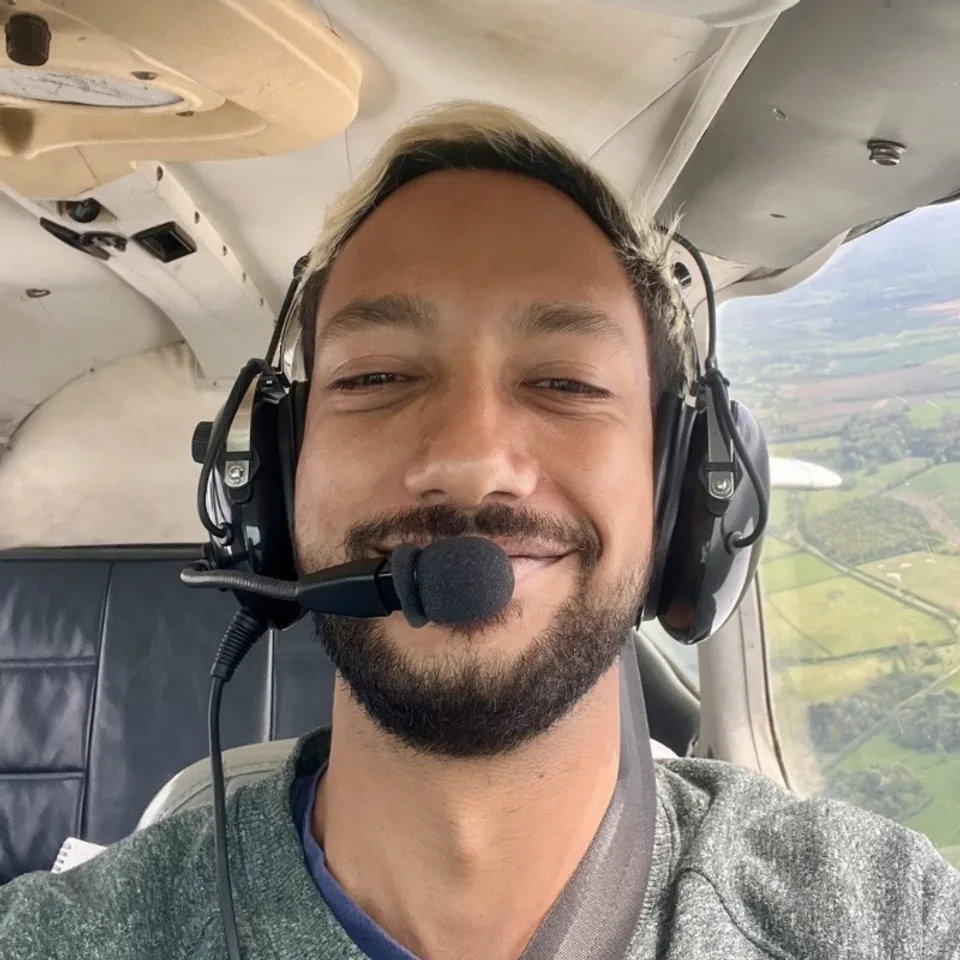 Daniel Johnson in a small aircraft, a personal photo showing the human side behind the operator profile